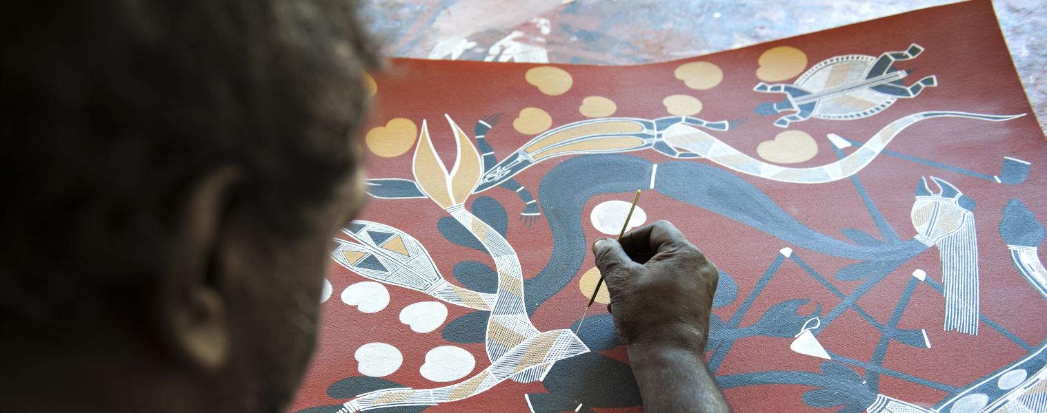 Aboriginal artist at work at the Injalak Community Centre