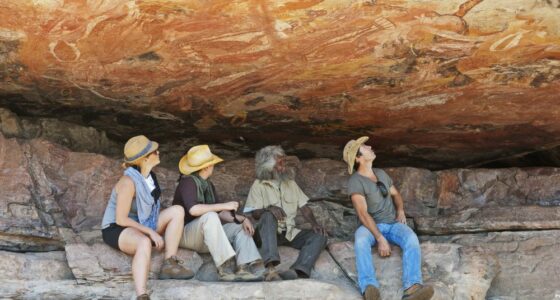 Viewing aboriginal rock art at Injalak Hill, Arnhem Land, Northern Territory, Australia