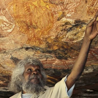 Tommo sharing his wealth of aboriginal rock art knowlege with visitors in Arnhem Land